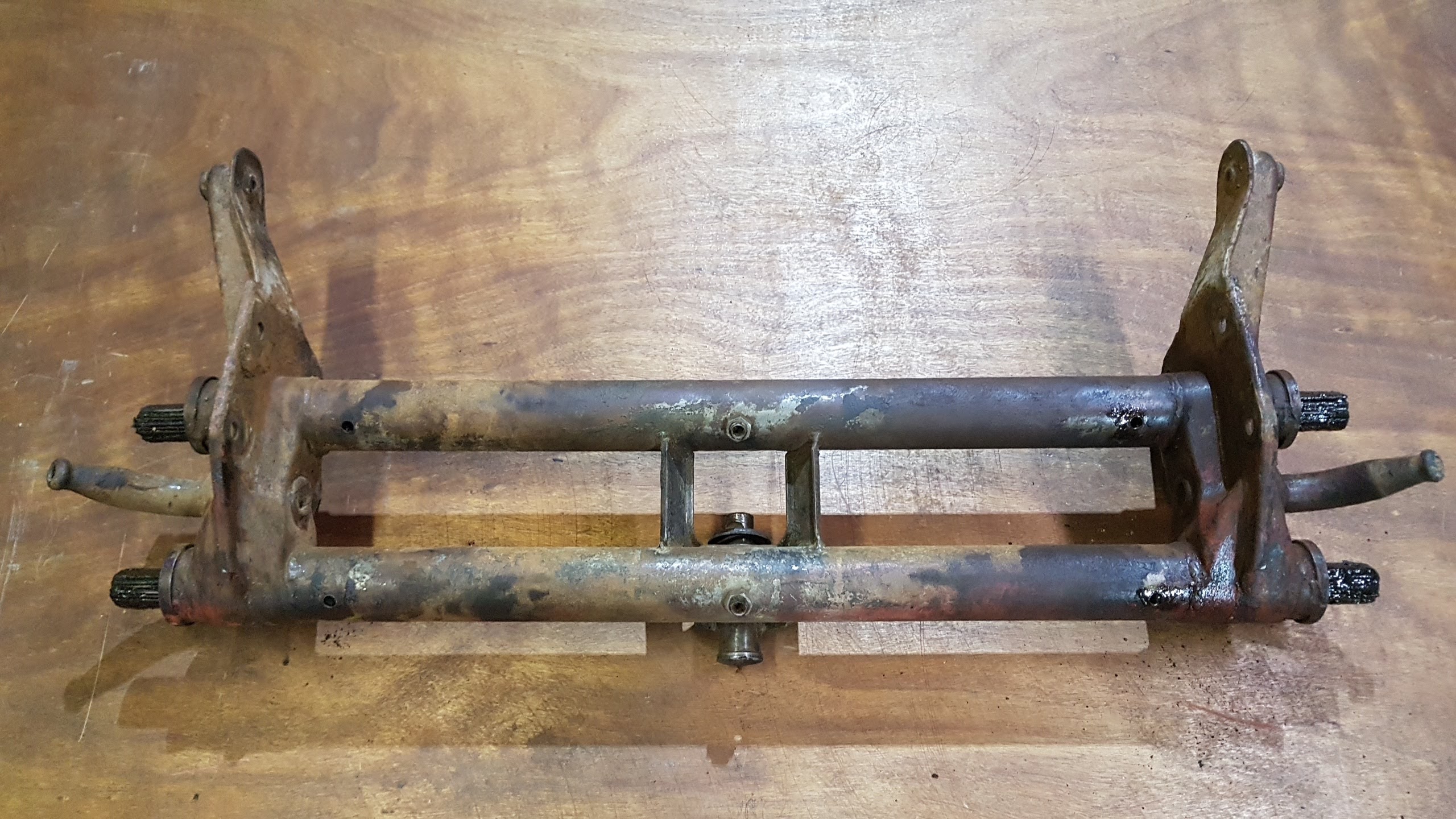 (USED) 211 401 061 FS Front axle beam, with torsion springs