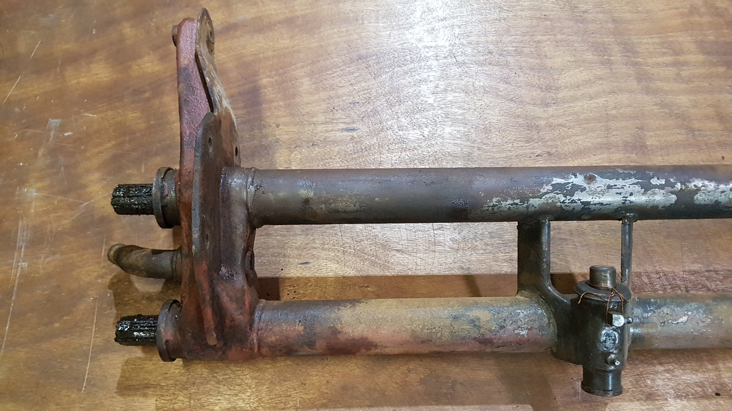 (USED) 211 401 061 FS Front axle beam, with torsion springs