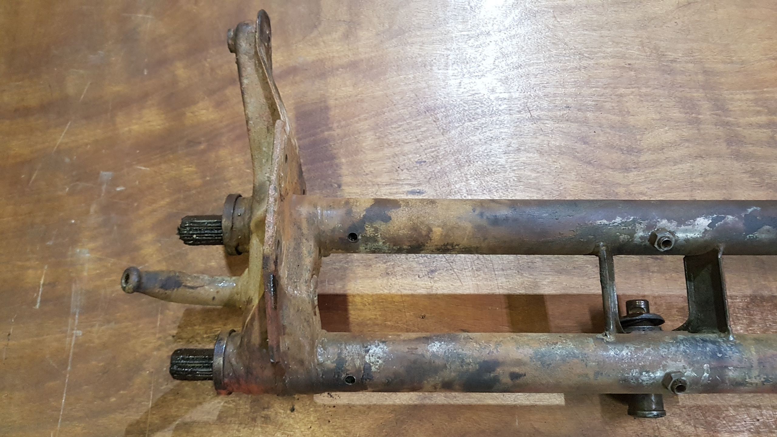 (USED) 211 401 061 FS Front axle beam, with torsion springs