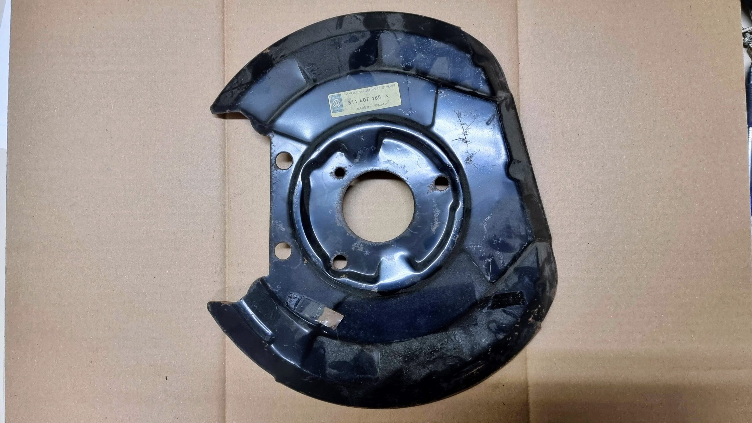 NOS 311407165A Splash shield, left, disc brake