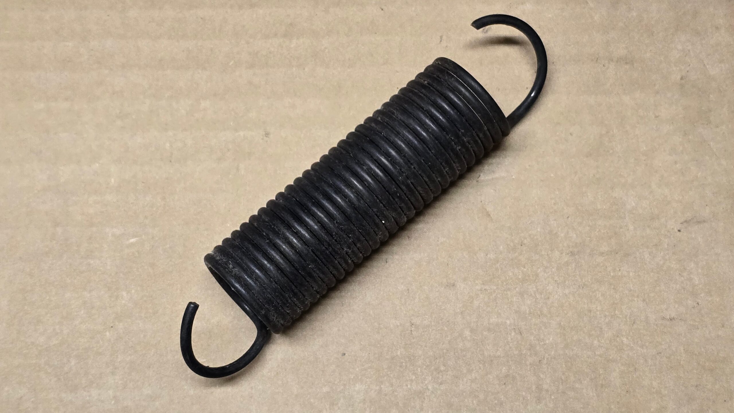 USED 111881245A Tension spring, front seat