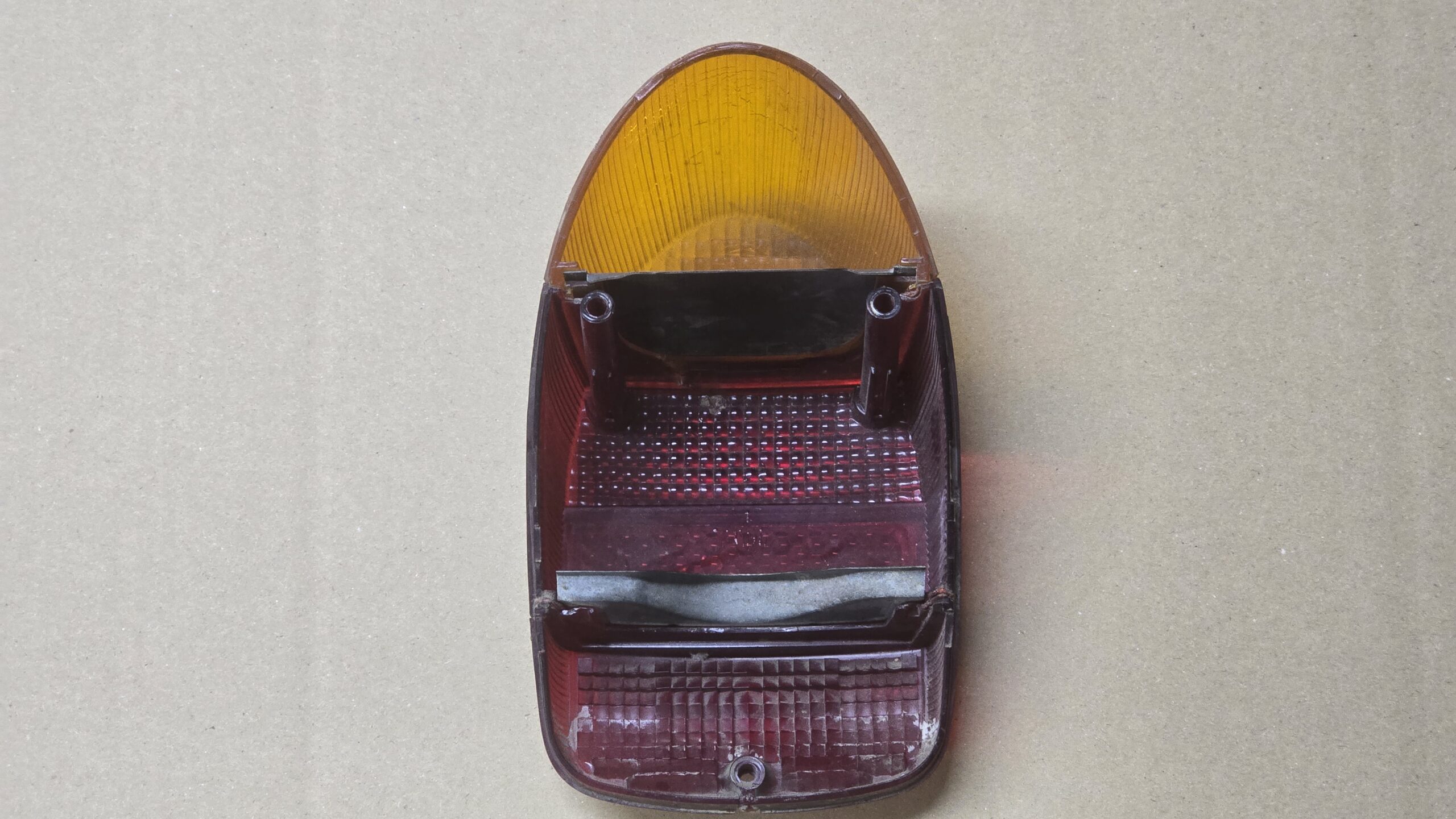 USED 111945241L Tail light lens, yellow/red